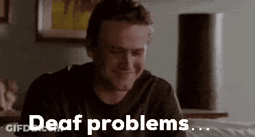 Man Sitting On Bed With Deaf Problems GIF