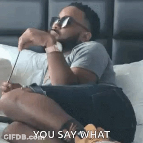 Man Sitting On Bed With Sunglasses And Pencil GIF