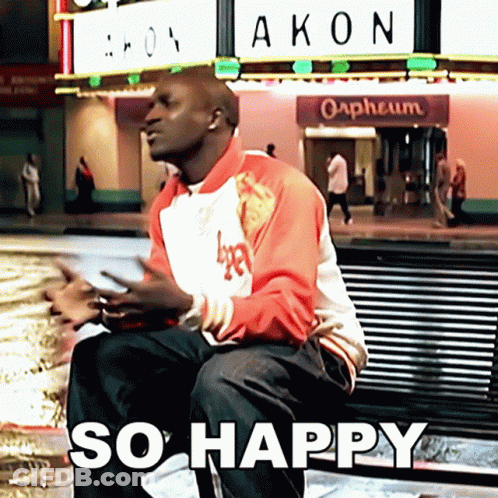 Man Sitting On Bench In Front Of Akon Orpheum GIF