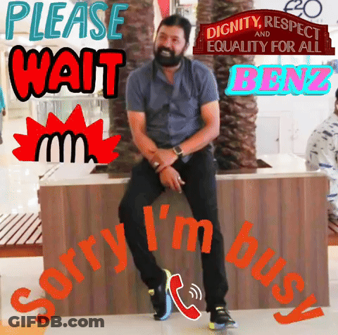 Man Sitting On Bench Saying Please Wait GIF