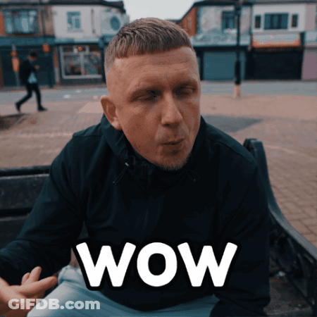 Man Sitting On Bench Saying Wow GIF