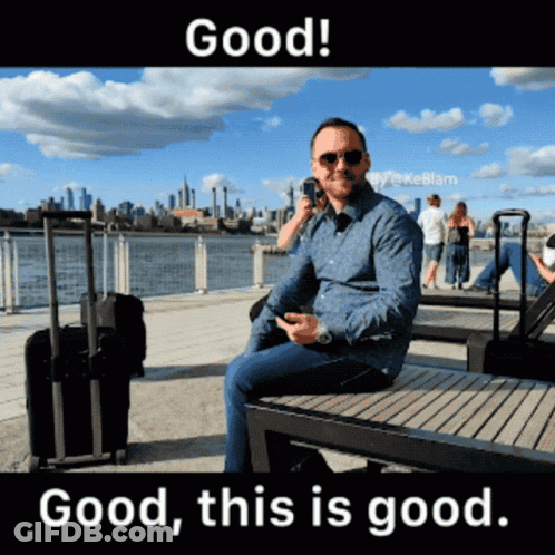 Man Sitting On Bench Talking On Phone GIF