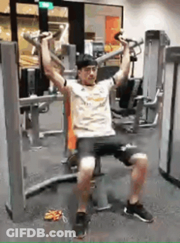 Man Sitting On Bench Using Gym Machine GIF