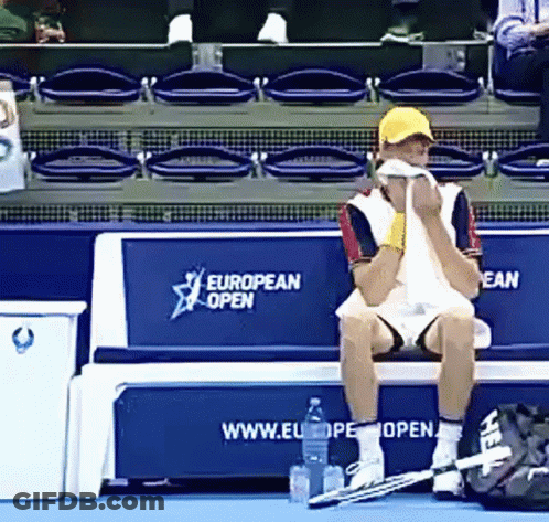 Man Sitting On Bench With European Open GIF