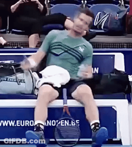 Man Sitting On Bench With Tennis Racquet GIF