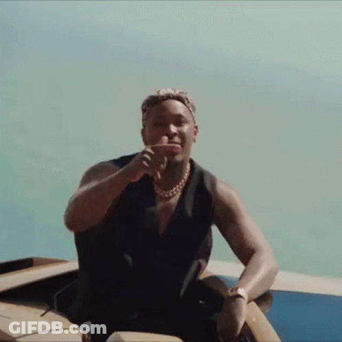 Man Sitting On Boat With Hand On Face GIF