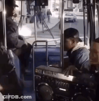 Man Sitting On Bus With Boombox On Dashboard GIF