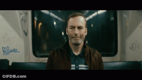 Man Sitting On Bus With Graffiti GIF