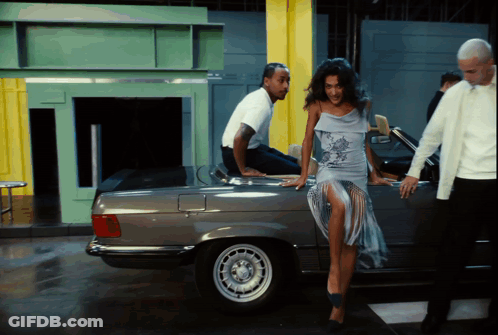Man Sitting On Car Back Woman Leaning GIF