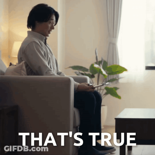 Man Sitting On Couch Behind True GIF
