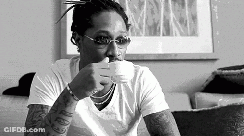 Man Sitting On Couch Drinking Coffee GIF