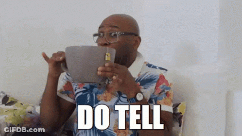 Man Sitting On Couch Drinking Tea GIF