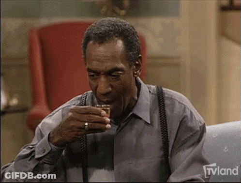 Man Sitting On Couch Drinking Whiskey GIF