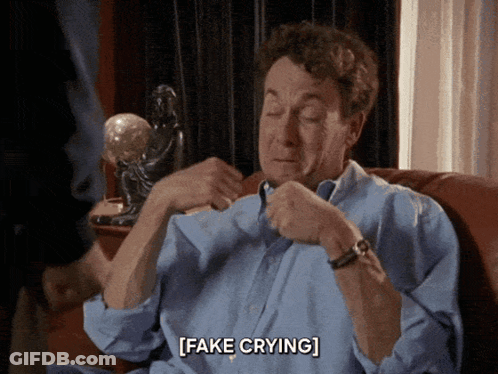 Man Sitting On Couch Fake Crying GIF