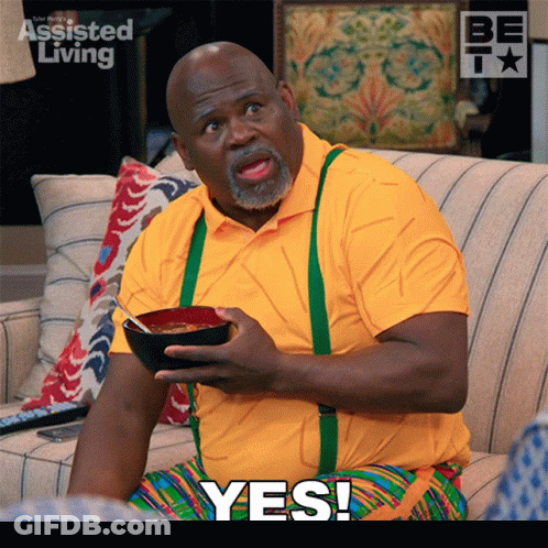 Man Sitting On Couch Holding Food Yes GIF