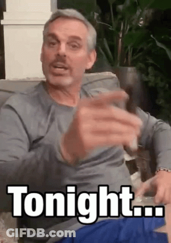 Man Sitting On Couch Holding Glass Saying Tonight GIF