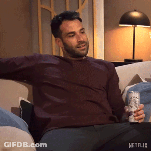 Man Sitting On Couch Holding Netflix Can GIF