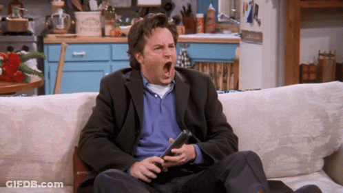 Man Sitting On Couch Holding Remote GIF