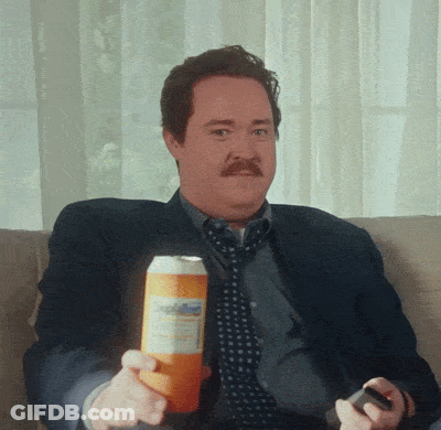 Man Sitting On Couch Holding Soda GIF