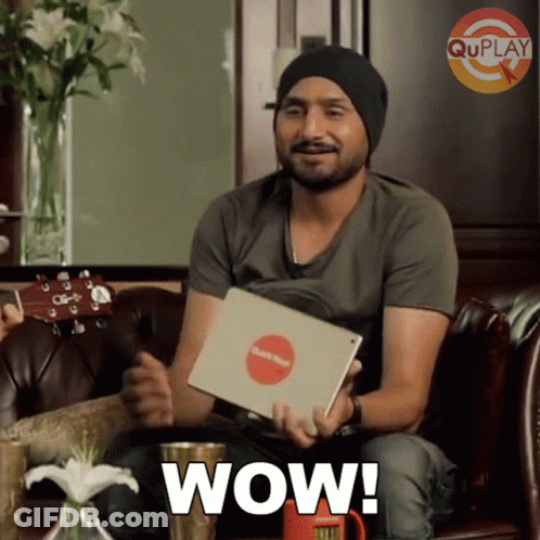 Man Sitting On Couch Holding Wow Tablet GIF