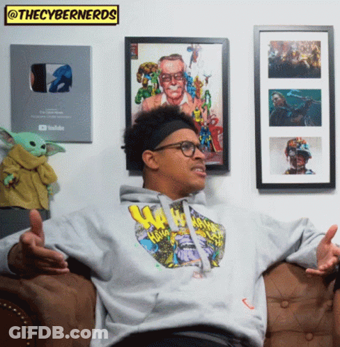 Man Sitting On Couch In Front Of Wall GIF