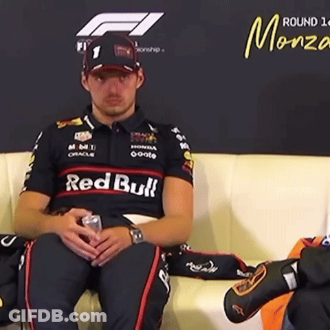 Man Sitting On Couch In Red Bull Shirt GIF