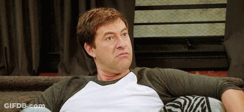 Man Sitting On Couch In White Shirt GIF