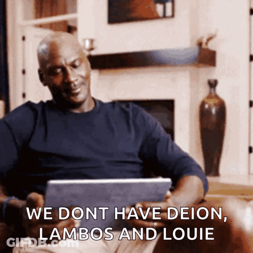 Man Sitting On Couch Looking At Tablet Saying We Dont Have Deion Lambos And Louie GIF