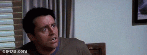 Man Sitting On Couch Making Funny Face GIF