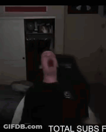 Man Sitting On Couch Mouth Open Dark Room Total Subs GIF