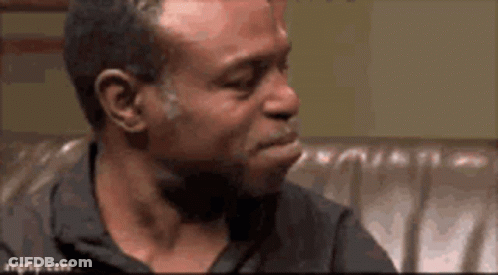 Man Sitting On Couch Mouth Open Looking GIF