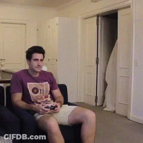 Man Sitting On Couch Playing Video Game GIF