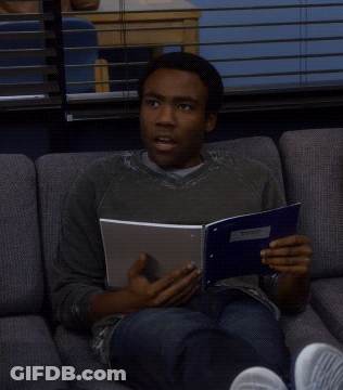 Man Sitting On Couch Reading Book Am I Using That Right GIF