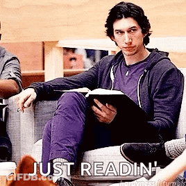 Man Sitting On Couch Reading Book GIF