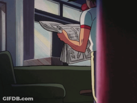 Man Sitting On Couch Reading Goro Newspaper GIF