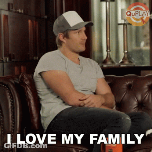 Man Sitting On Couch Saying I Love My Family GIF