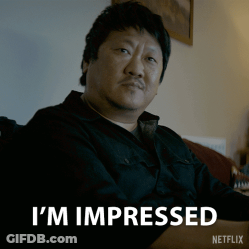 Man Sitting On Couch Saying I'm Impressed GIF