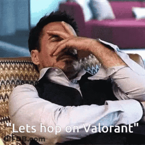 Man Sitting On Couch Saying Lets Hop On Valorant GIF