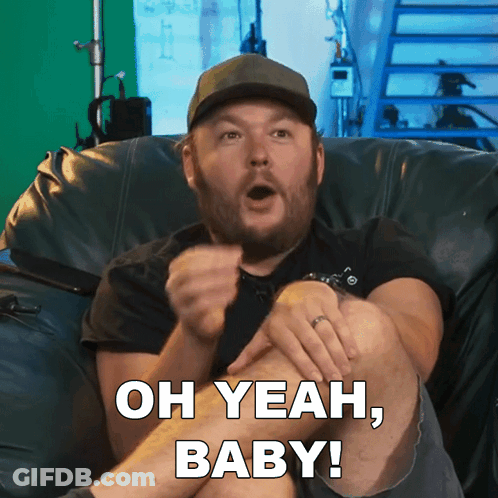 Man Sitting On Couch Saying Oh Yeah Baby GIF