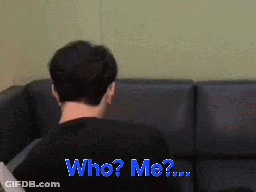 Man Sitting On Couch Saying Who Me GIF