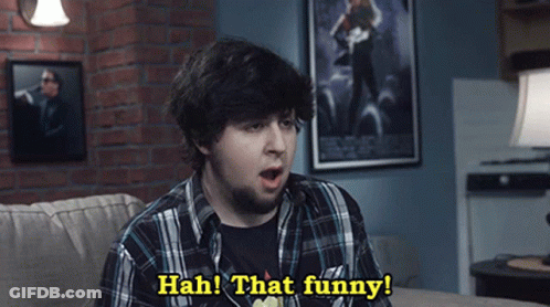Man Sitting On Couch Says Hah That Funny GIF
