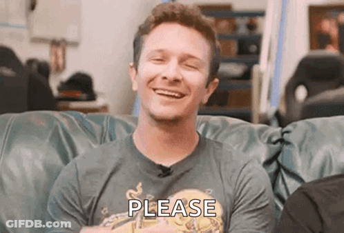 Man Sitting On Couch Smiling Wearing Shirt Please GIF