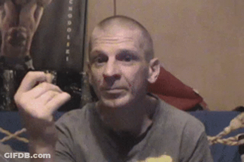 Man Sitting On Couch Smoking Cigar GIF
