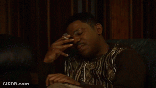 Man Sitting On Couch Smoking Cigarette GIF