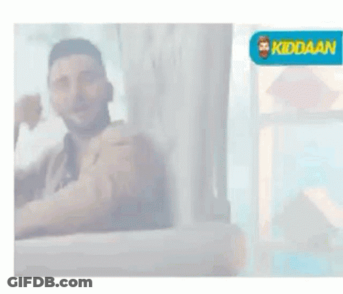 Man Sitting On Couch Thumbs Up Smiling GIF