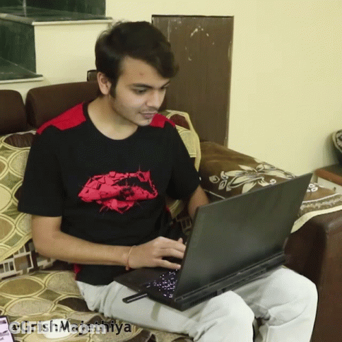 Man Sitting On Couch Using Laptop @Grishmajethiya GIF