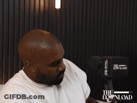 Man Sitting On Couch Wearing Headset Saying The Download GIF