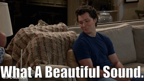 Man Sitting On Couch What A Beautiful Sound GIF
