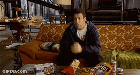 Man Sitting On Couch With Bag Of Cheetos GIF