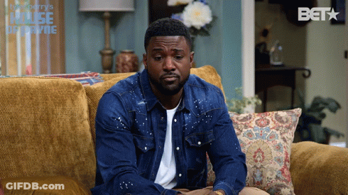 Man Sitting On Couch With Bet Logo GIF